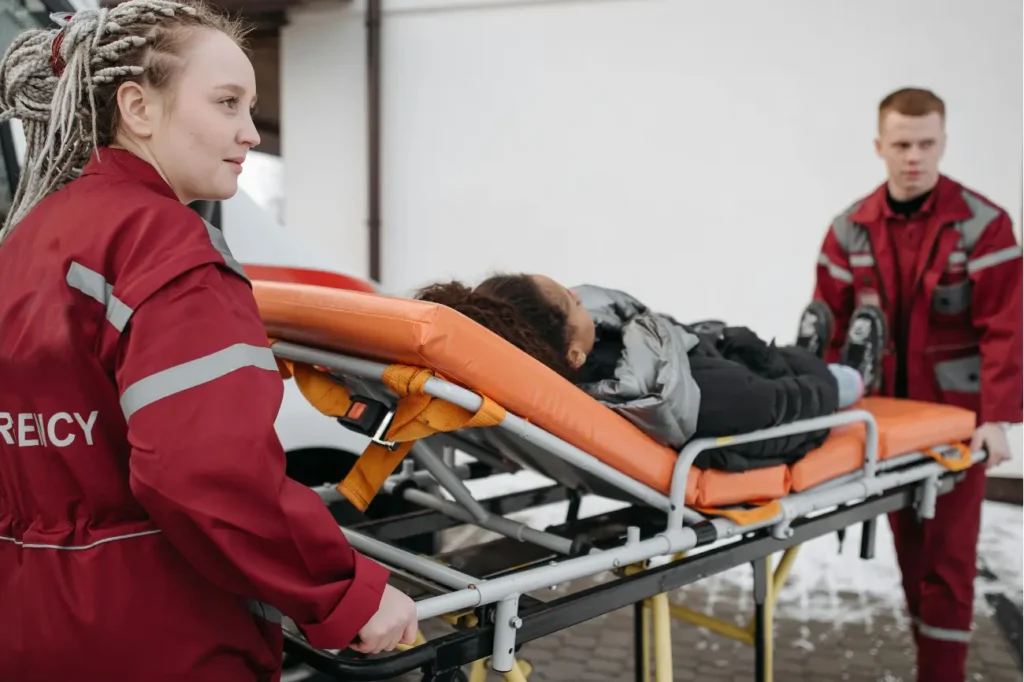 “NEMT driver assisting dialysis patient with wheelchair support”